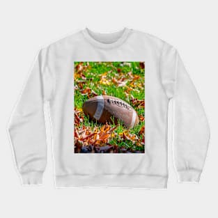 Touchdown!  football on a leafy field Crewneck Sweatshirt